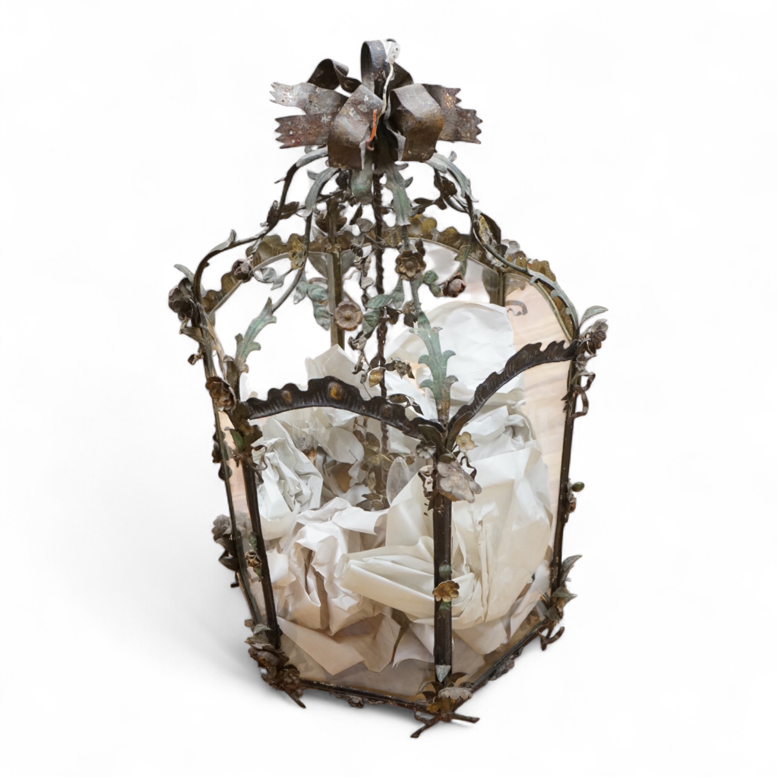 A large French painted wrought iron decorative floral and swagged hexagonal hall lantern, 84cm high